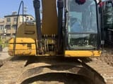 2012 Caterpillar 323DL crawler excavator front view
