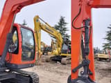 2024 Doosan DX80 mini excavator, close-up view of boom and bucket