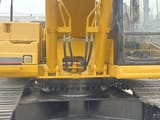 Caterpillar 330BL crawler excavator, close-up of boom base and cab