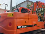 2023 Doosan DX140LC crawler excavator, rear three-quarter view