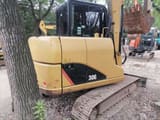 2022 Caterpillar 306E2 excavator, rear three-quarter view
