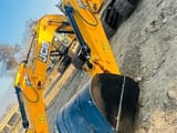 2026 JCB NXT 215LC crawler excavator, low-angle front view