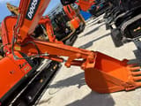 2022 Doosan DX55 crawler excavator, close-up of boom and bucket