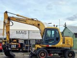 1998 Komatsu PW130ES wheel excavator side view