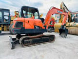 2022 Doosan DX60 crawler excavator, rear three-quarter view