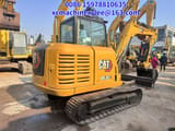 2023 Caterpillar 305.5E2 mini excavator, rear three-quarter view