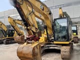2024 Caterpillar 312GC crawler excavator, front three-quarter view