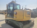 2023 Caterpillar 308.5E2 mini excavator, rear three-quarter view