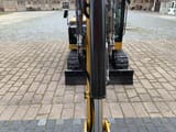 Caterpillar 306CR-07A mini excavator, front view from boom perspective