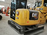 Caterpillar 307E2 mini excavator, rear three-quarter view
