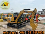 2023 Caterpillar 305.5E mini excavator, side profile view