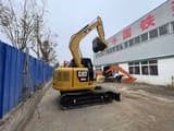 2024 Caterpillar 308E2 mini excavator, rear three-quarter view