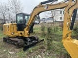 Caterpillar 306 mini excavator, rear three-quarter view