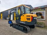 2025 Hyundai HX60PRO mini excavator, rear three-quarter view