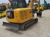 2021 Caterpillar 305.5E2 mini excavator, rear three-quarter view