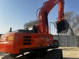 2023 Hitachi Zaxis 210 crawler excavator, rear three-quarter view