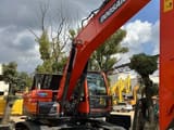 2024 Doosan DX225LC-9C crawler excavator, front three-quarter view