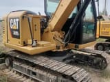 2023 Caterpillar 307E2 mini excavator rear three-quarter view