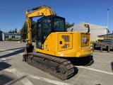 2022 Caterpillar 310 crawler excavator, rear three-quarter view