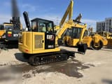 2024 Caterpillar 305.5E2 mini excavator, rear three-quarter view