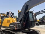 2022 Volvo EC140 crawler excavator, rear three-quarter view