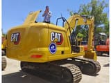 2023 Caterpillar 320GC crawler excavator rear three-quarter view