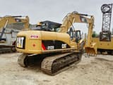 2022 Caterpillar 312D excavator, rear three-quarter view