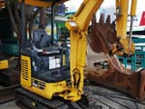 2022 Komatsu PC18MR mini excavator, front three-quarter view