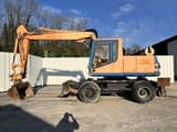 1997 Caterpillar M315 wheel excavator, side profile view