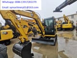 2024 Caterpillar 306E2 mini excavator, front three-quarter view