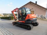 2017 Kubota KX080-4 mini excavator, rear three-quarter view