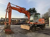 2004 Kobelco E145W wheel excavator side view