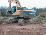 2026 Hyundai R225LC-9T crawler excavator, rear three-quarter view