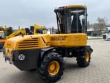 2010 Mecalac 12MTX wheel excavator, rear three-quarter view
