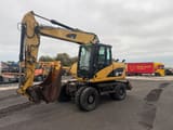 2008 Caterpillar M313D wheel excavator, side view