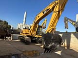 2024 Caterpillar 325BL crawler excavator, front three-quarter view