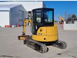 2021 Caterpillar 303.5E2 crawler excavator, rear three-quarter view