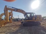 2022 Caterpillar 320GC crawler excavator, side profile view