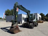 2009 New Holland MH-PLUS wheel excavator, front three-quarter view
