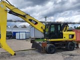 2011 Caterpillar M318D MH material handler, side view