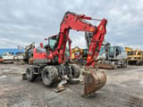 2011 Komatsu PW98MR-8 wheel excavator, front three-quarter view