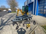 Berger Kraus BK950KS mini excavator on trailer with attachments
