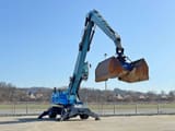 2011 Terex Fuchs MHL360 material handler, side view with clamshell bucket