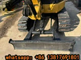 2023 Caterpillar 303CCR mini excavator front view with blade