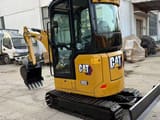 2024 Caterpillar 302 mini excavator, front three-quarter view