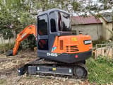 2022 Doosan DH55 Gold mini excavator, rear three-quarter view