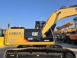 2023 Caterpillar 323DL excavator, side view