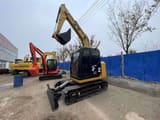 2024 Caterpillar 308E mini excavator, front three-quarter view