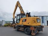 2018 Caterpillar MH3024 material handler, rear three-quarter view