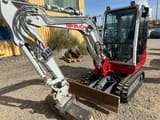 2025 Takeuchi TB230 V3 mini excavator, front three-quarter view